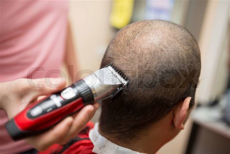 Men's grooming trimmer in a beauty salon, stock photo