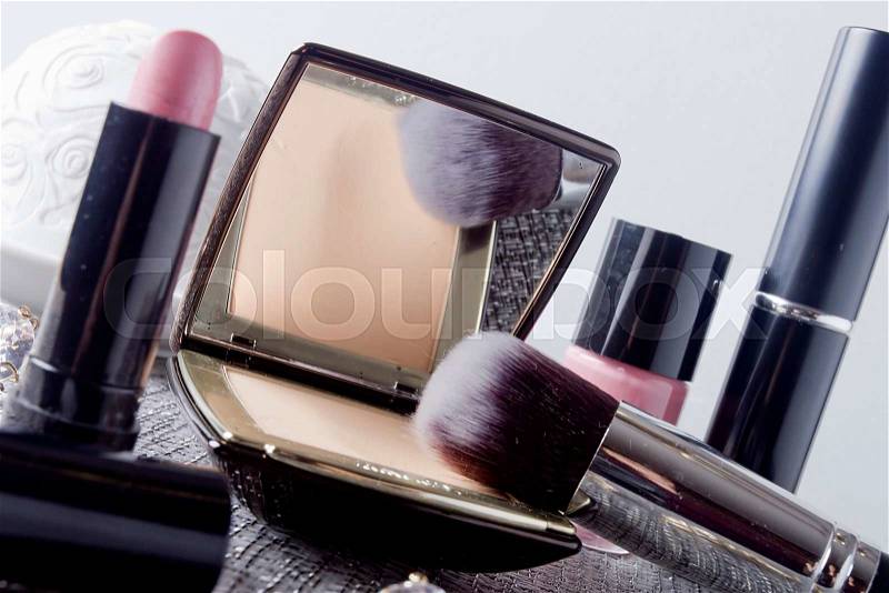 Women\'s powder box with mirror and cosmetic brush make-up, stock photo
