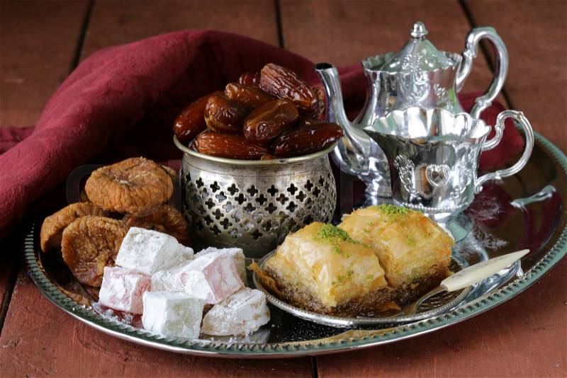 Assorted eastern sweets - baklava, dates, turkish delight, stock photo
