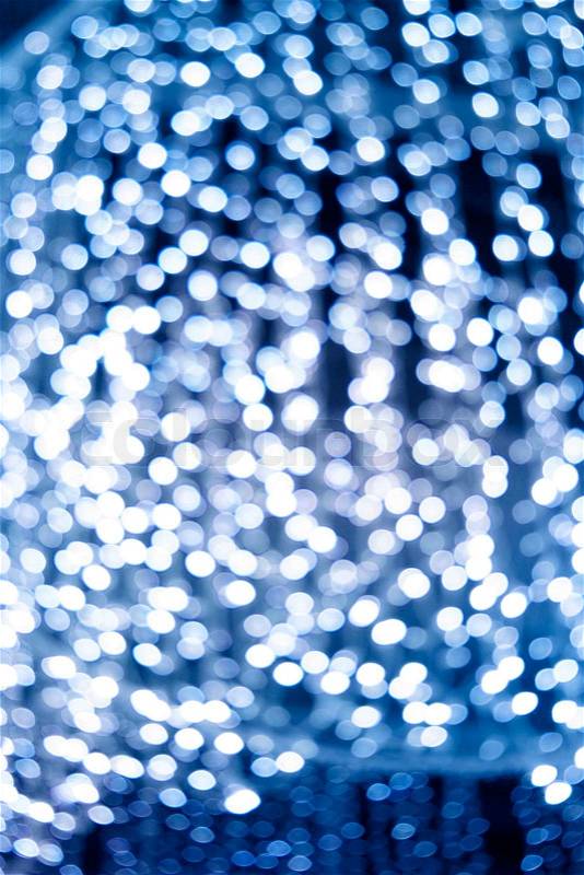 Blue festive style light spots blur on dark background, stock photo