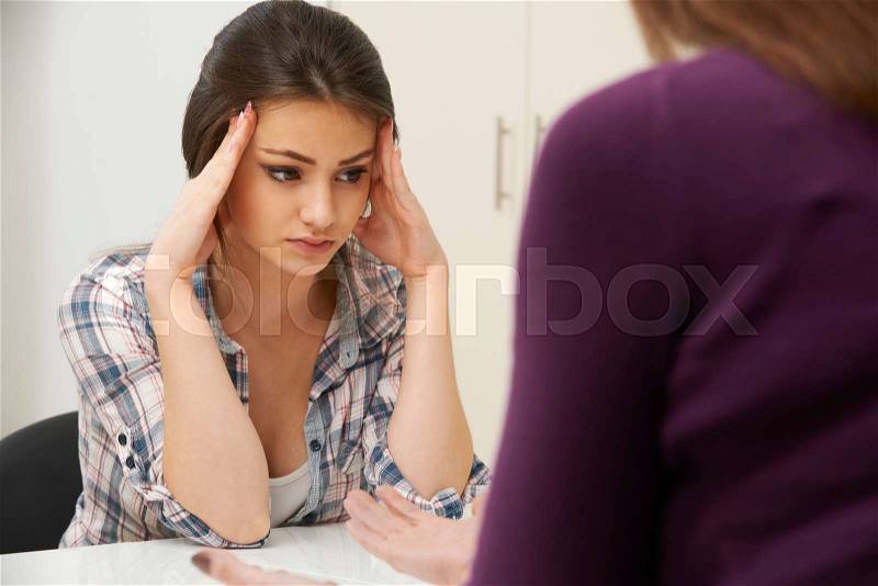 Teenage Girl Visiting Counsellor To Treat Depression, stock photo