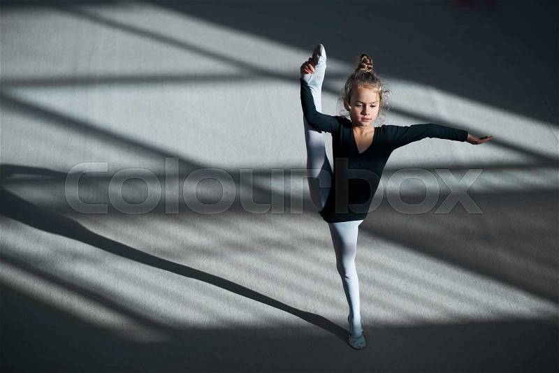 Girl doing stretching in Rhythmic Gymnastics, stock photo
