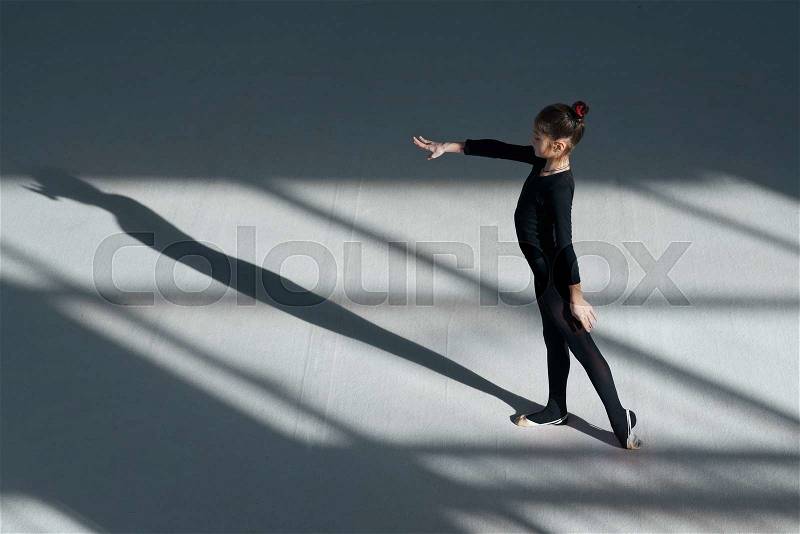 Girl dancing in the hall rhythmic gymnastics, stock photo