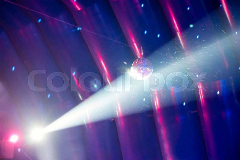 Disco ball and blue light ray on the stage, stock photo