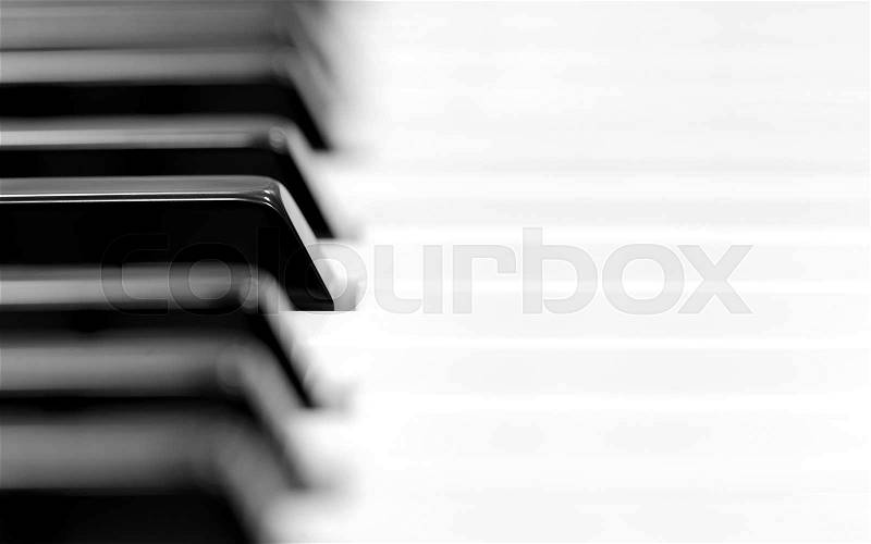 Close-up of piano keyboard. Close frontal view, stock photo