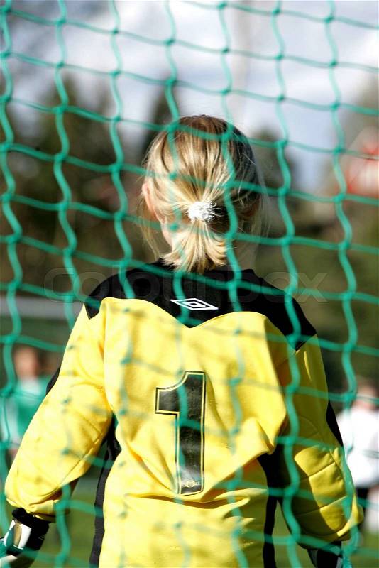 Young female goal keeper, stock photo