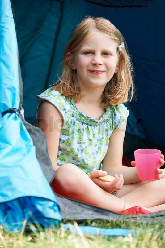 Girl Having Snack On Camping Trip, stock photo