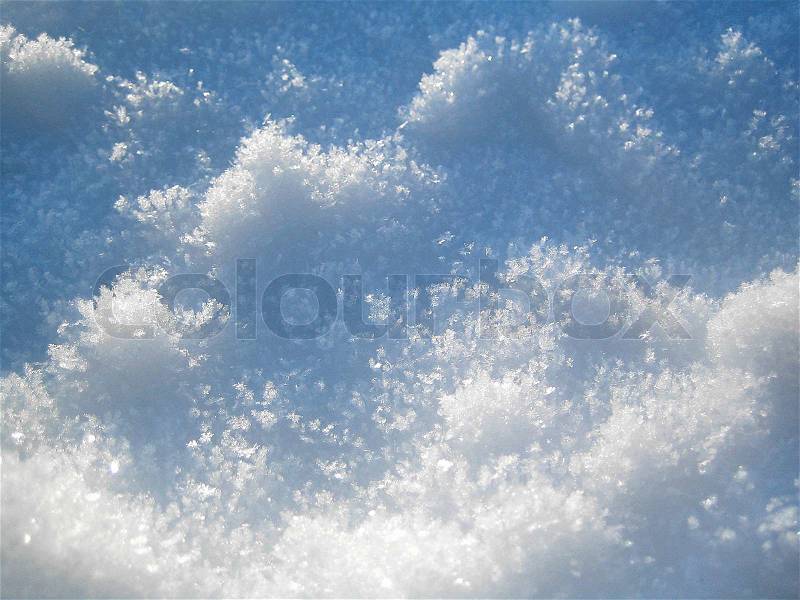 Pure white snow in clean daylight, with snow flakes showing, stock photo