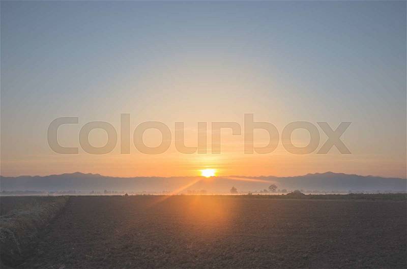 Sunrise over the fields, stock photo