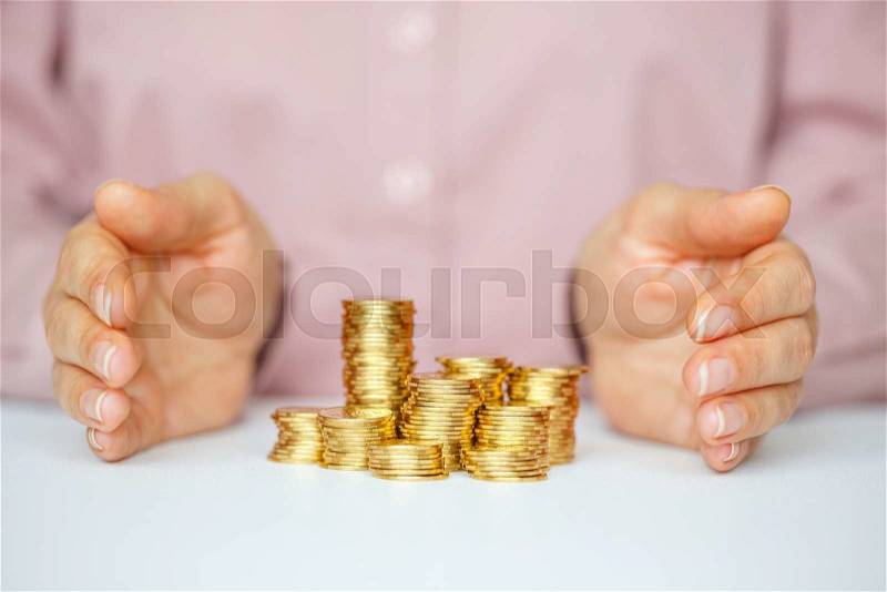 Protect new business start-up concept - with hands and coin, stock photo
