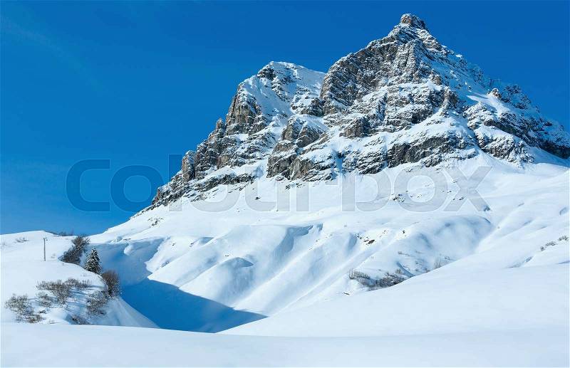 Winter mountain rocky top view with snowy slope (Austria, Tyrol), stock photo