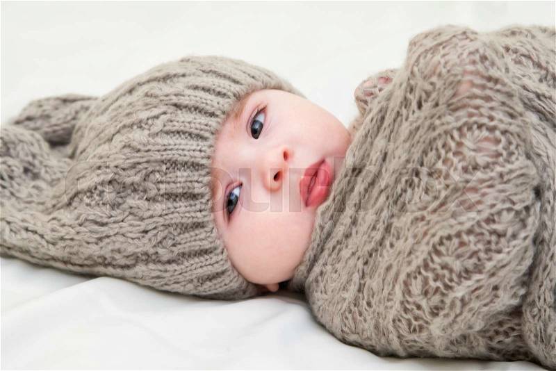 A cute little baby. Newborn baby girl in pink knitted hat. Parenting or love concept. Toned photo, stock photo
