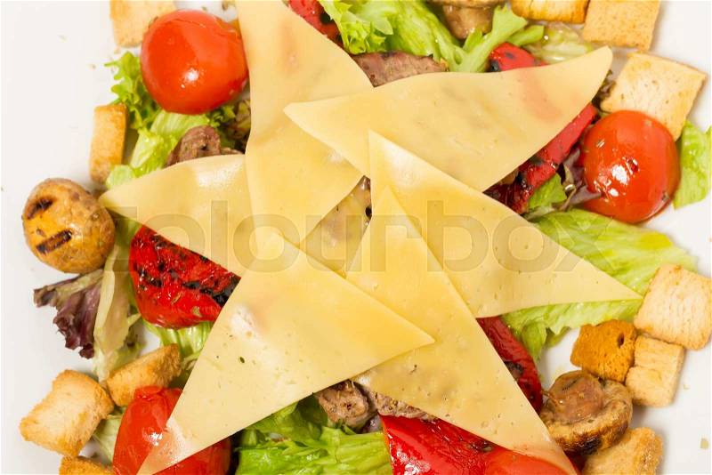 Warm salad with vegetables and cheese. Can be used as a background, stock photo