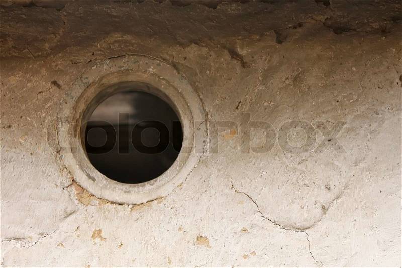 Ventilation hole in the wall of the old barn, stock photo