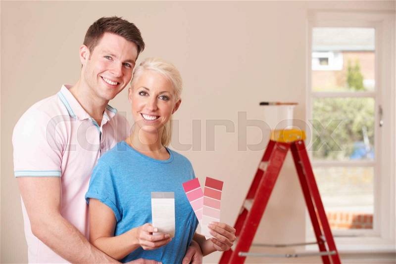 Couple Looking At Paint Swatches Together, stock photo
