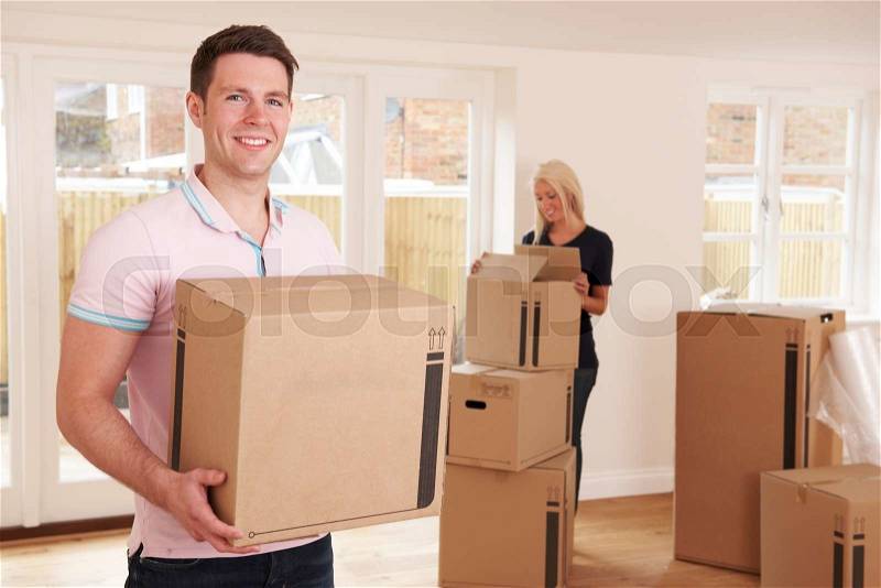Young Couple Moving Into New Home, stock photo