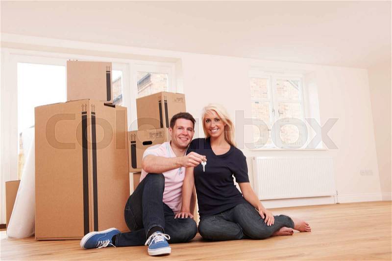 Couple Moving Into New Home Holding Keys, stock photo