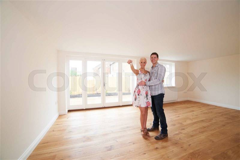 Young Couple With Keys To New Home, stock photo