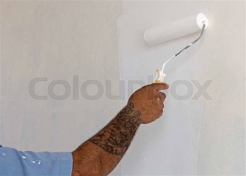 Hand paint color on white cement wall background, stock photo