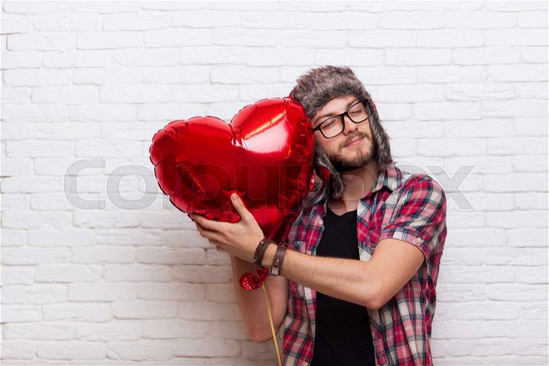 Man Hug Red Heart Shape Baloon Close Eyes Hipster Fashion Style Wearing Hat Glasses, stock photo
