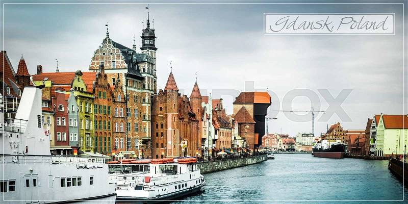 Cityscape on the Vistula River in historic city of Gdansk at sunset in Poland, stock photo