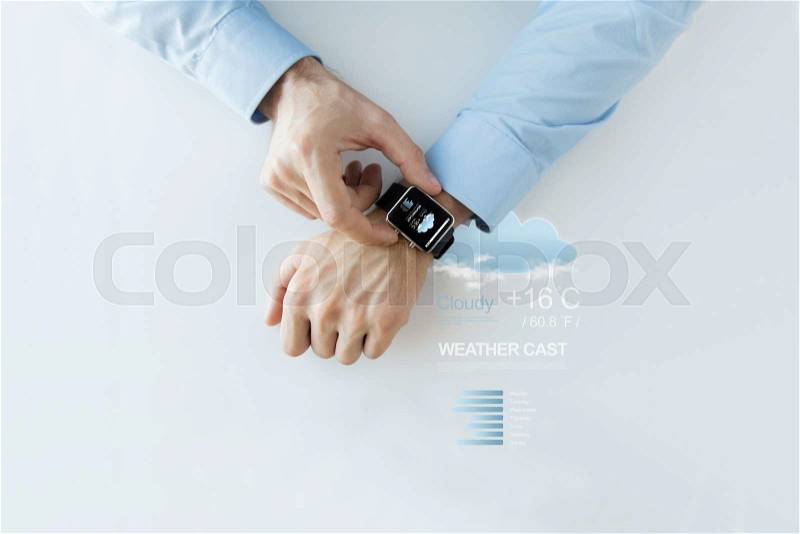Business, technology, weather forecast, application and people concept - close up of male hands setting smart watch with meteo cast on screen, stock photo