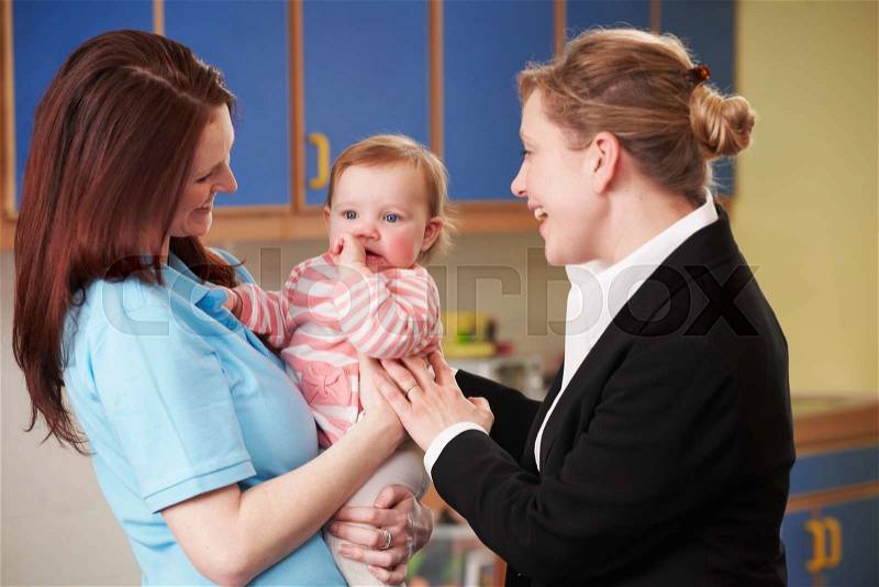 Working Mother Dropping Child At Nursery, stock photo