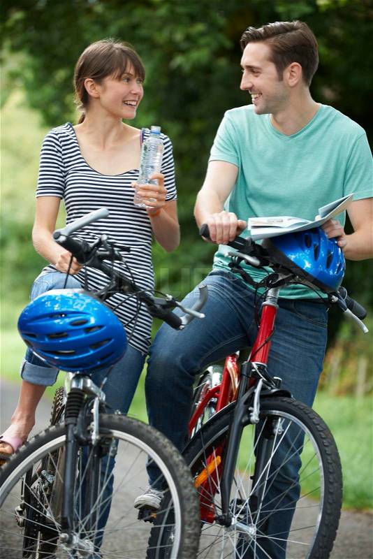 Young Couple Having Break Whilst On Country Cycle Ride, stock photo