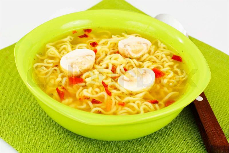 Tasty Chicken Soup with Chinese Noodles. Studio Photo, stock photo