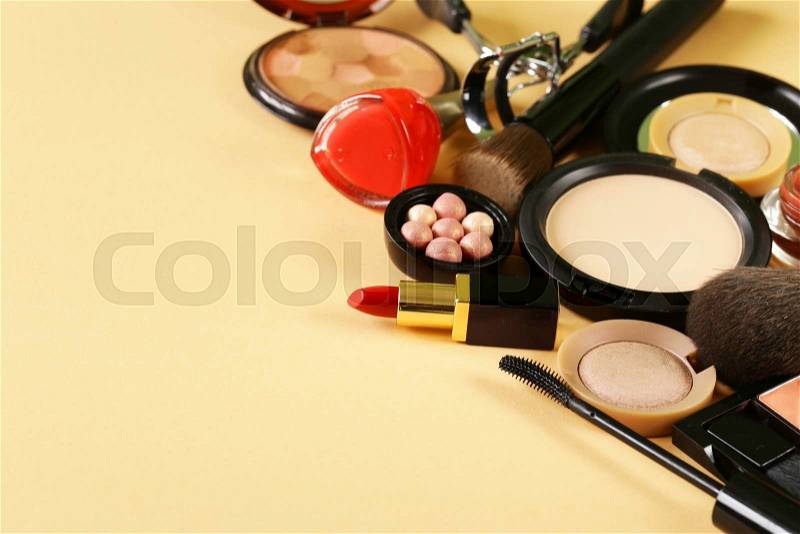 Cosmetics set for make-up (face powder, lipstick, mascara brush, nail polish, blush, eye shadow), stock photo