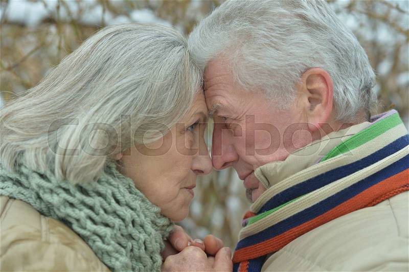 Happy senior couple at winter outdoors close up, stock photo