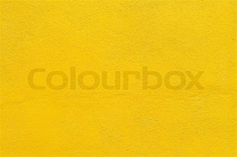 Yellow wall background, under a sunny day, stock photo