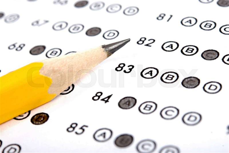 Test score sheet with answers and pencil, stock photo