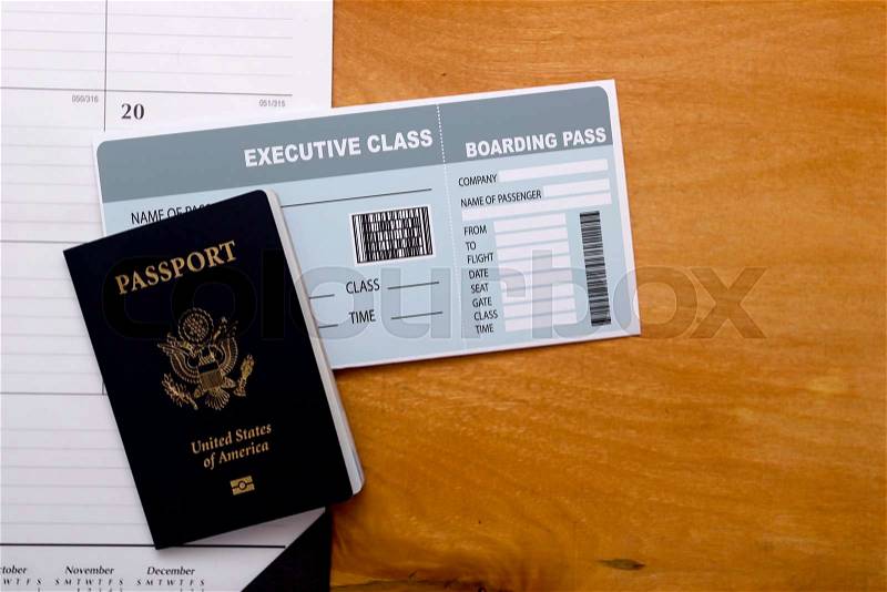 Travel documents: passport and tickets with calendar in the background, stock photo