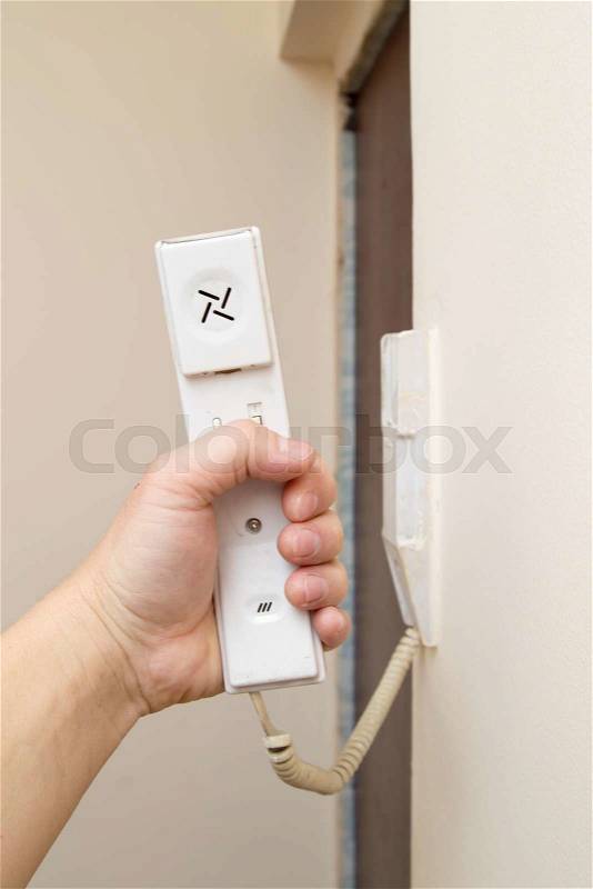 Phone attached to the wall, stock photo
