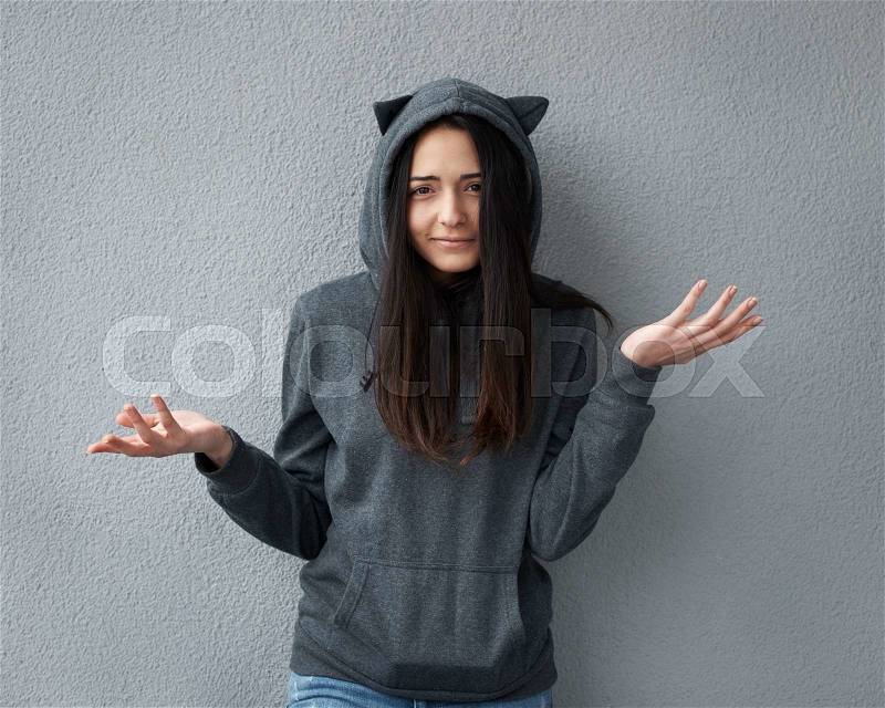 Teen girl does not understand what happened, stock photo