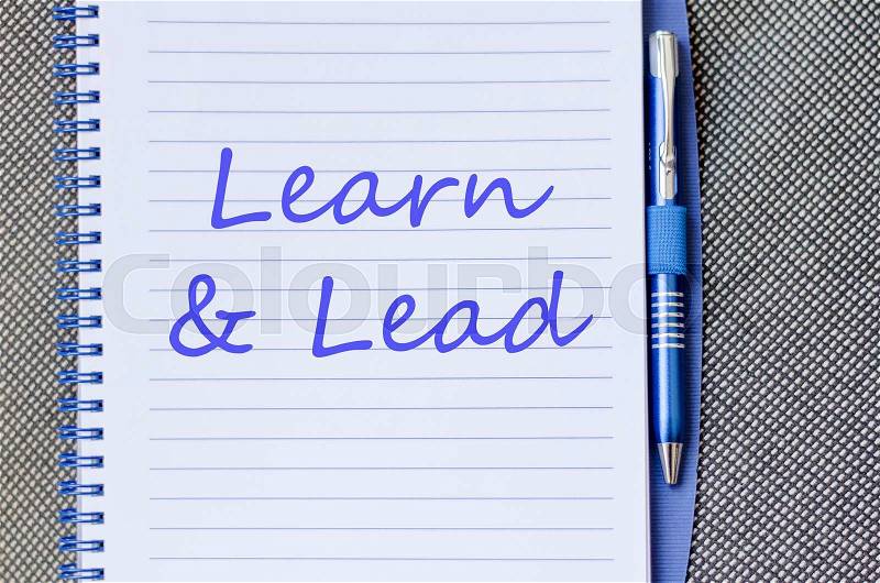 Learn & Lead text concept write on notebook, stock photo