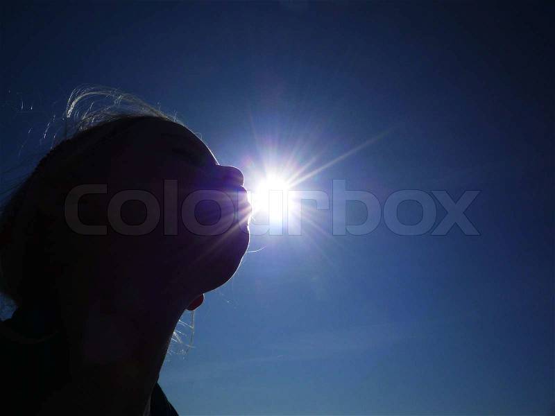 Kissing the sun, stock photo
