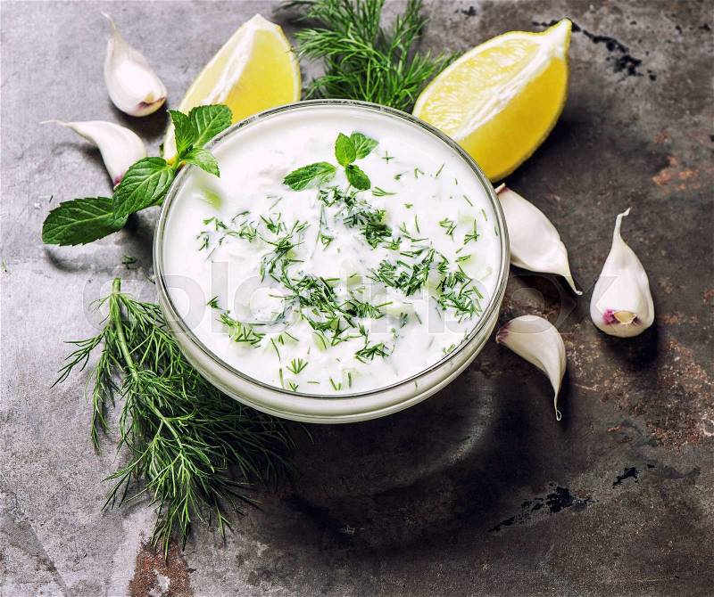 Greek tzatziki sauce. Dill, mint, garlic, lemon. Healthy nutrition, stock photo