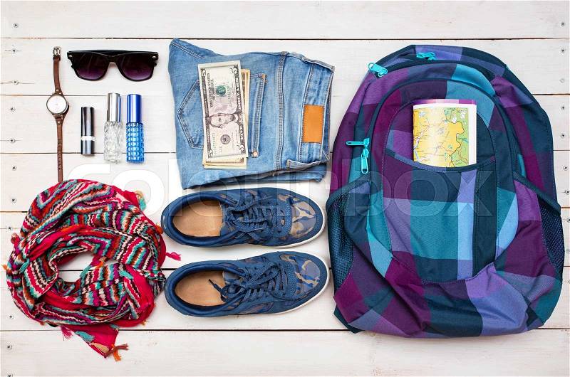 What to Pack in Your Carry On girl Bag - backpack, money, glasses, shoes, jeans, accessories , stock photo