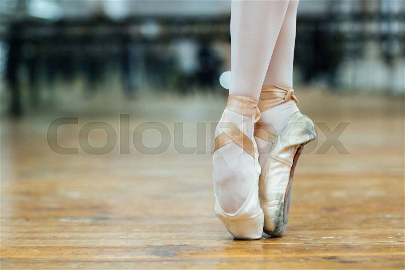 Cropped image of a female ballet dancer standing on toes , stock photo