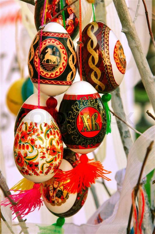 Composition from the easter ornamented eggs connected by a rope, stock photo