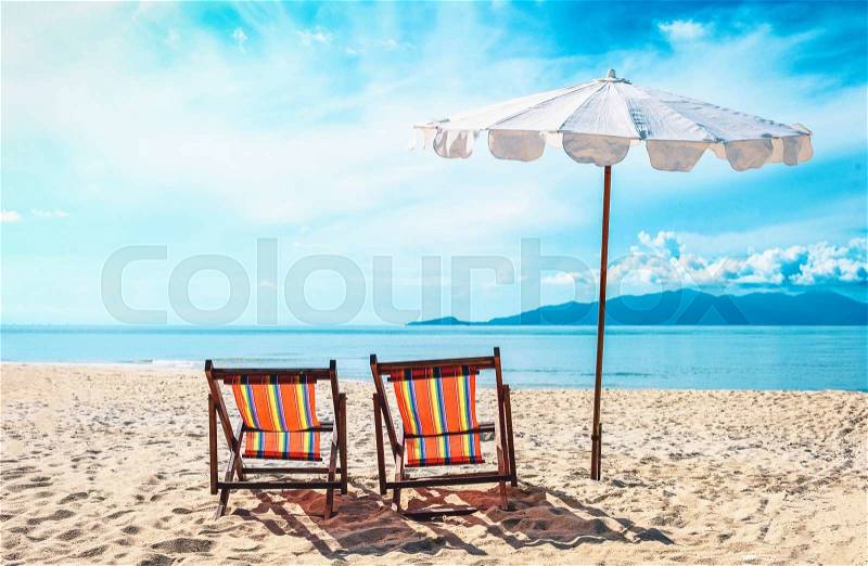 Chairs on the beach near with sea. Vacation concept, stock photo