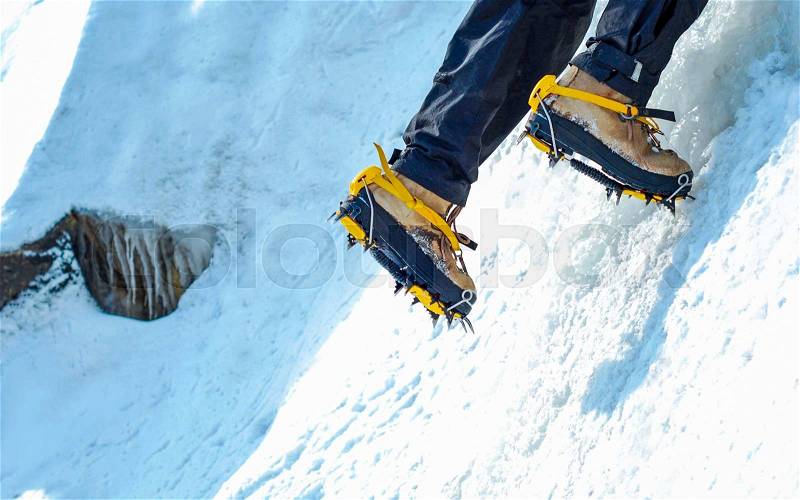 A climber reaching the summit. Extreme sport concept, stock photo