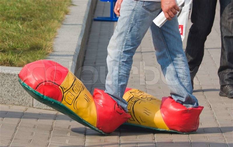 1776379-pedestrian-on-the-street-in-clown-shoes.jpg