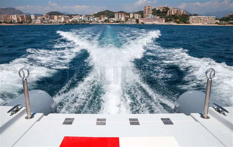 Bow wave of fast motor boat departures port of Ajaccio, Corsica, France , stock photo