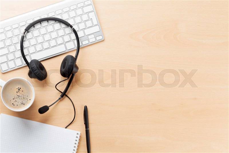 Office desk with headset and pc. Call center support table. Top veiw with copy space, stock photo