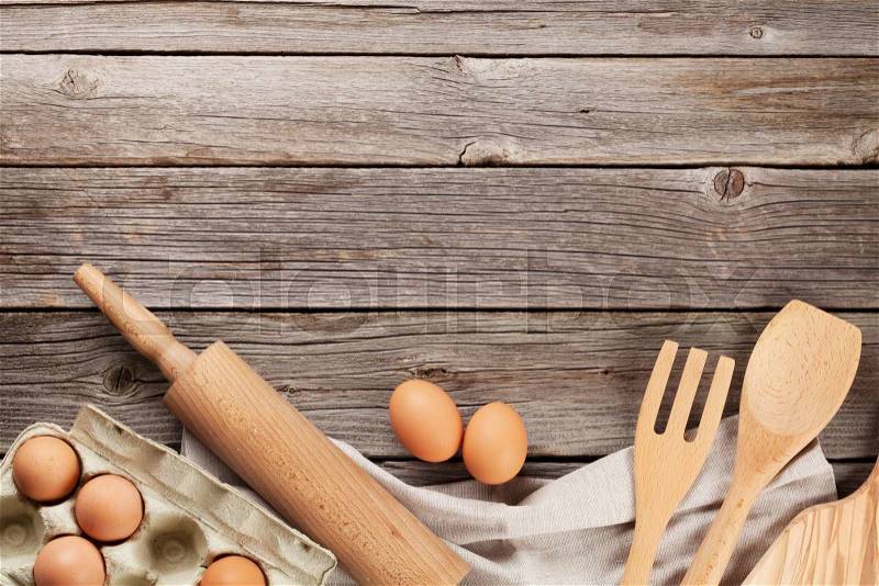 Cooking utensils and ingredients on wooden table. Top view with copy space, stock photo