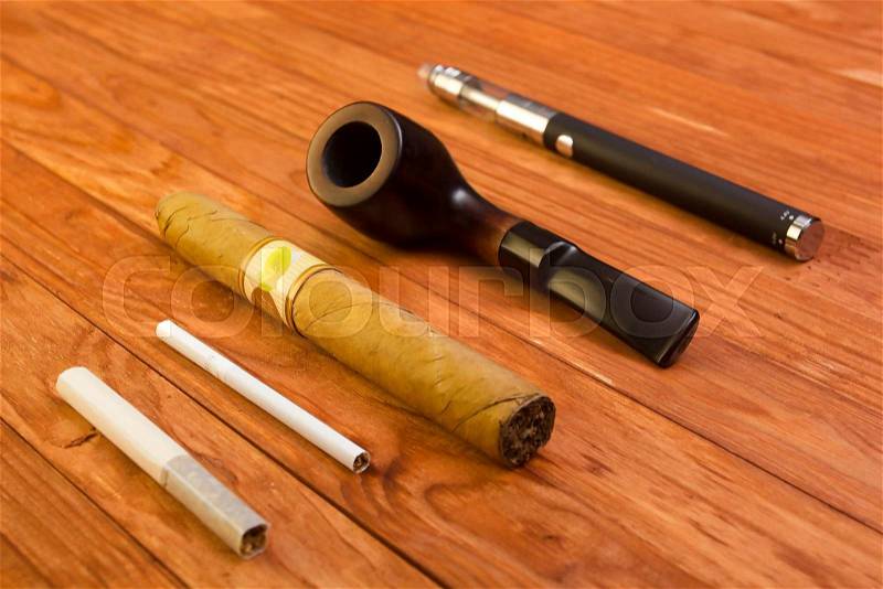 Set of smoking accessories on wooden background, stock photo