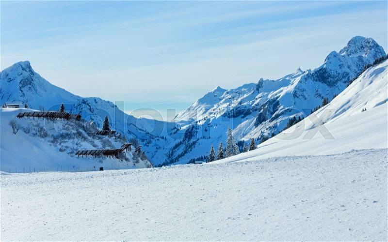 Winter mountain rocky top and snow-barrier on hill (Austria, Tyrol), stock photo